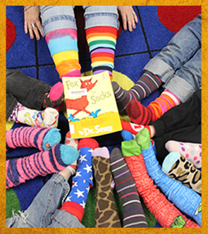 students with colorful socks with the book Fox for Socks