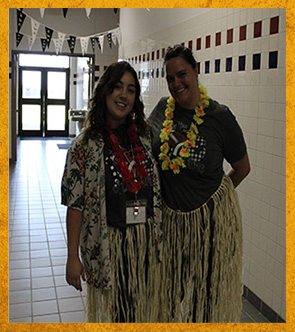 Two students dressed in Hawaiian apparel