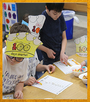 Students wearing 100 days smarter crowns